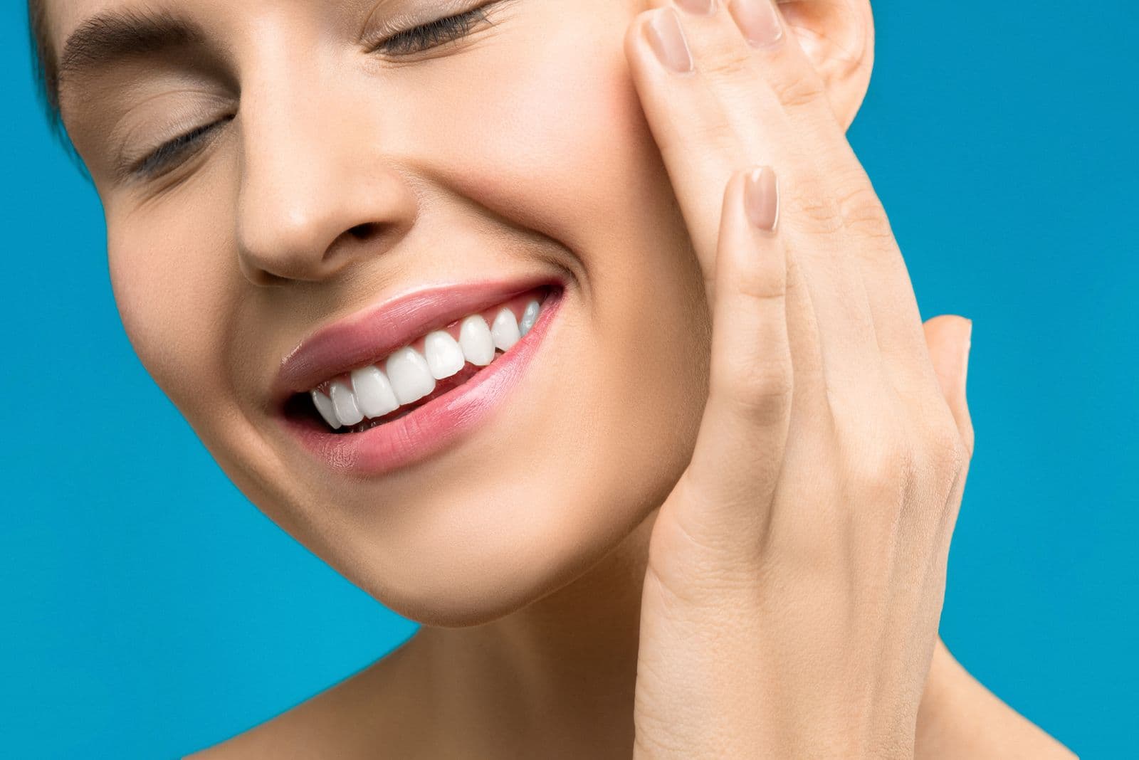 Laughing patient with healthy teeth — illustrative image for the demo